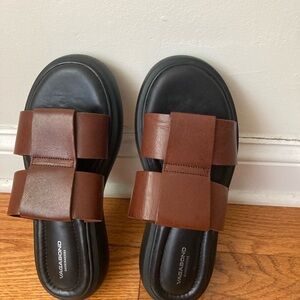 Vagabond Black and Brown Leather Slides. Preowned in good condition.